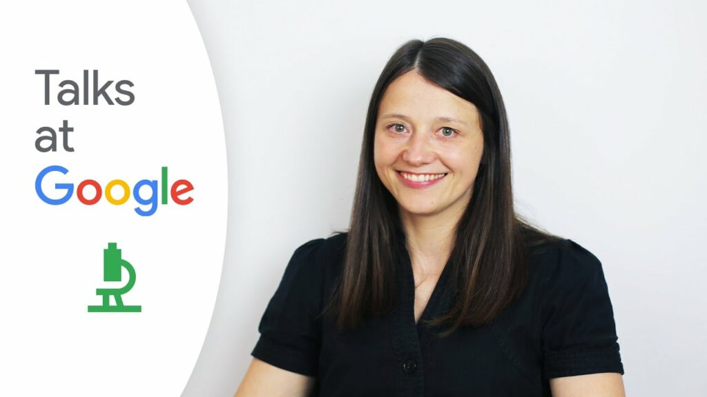 Gabija Toleikyte smiles towards the camera against a white background