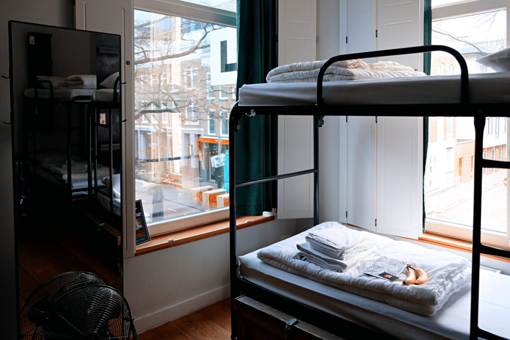 Hostel bunk beds in small room